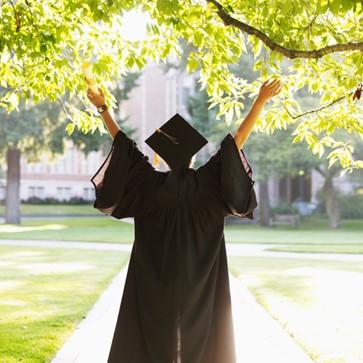 Graduate in cap and gown.